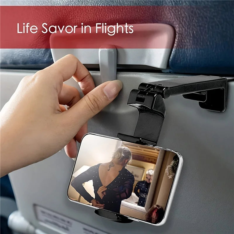 Phone holder being used to clip on to the tray table on an airplane