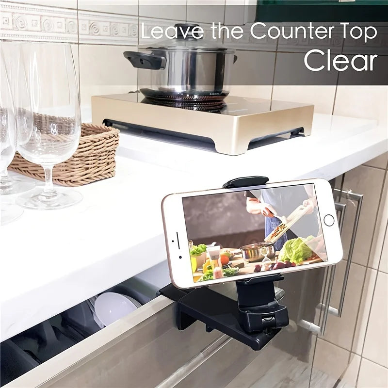 phone holder being used a stand while watching cooking tutorials in a kitchen